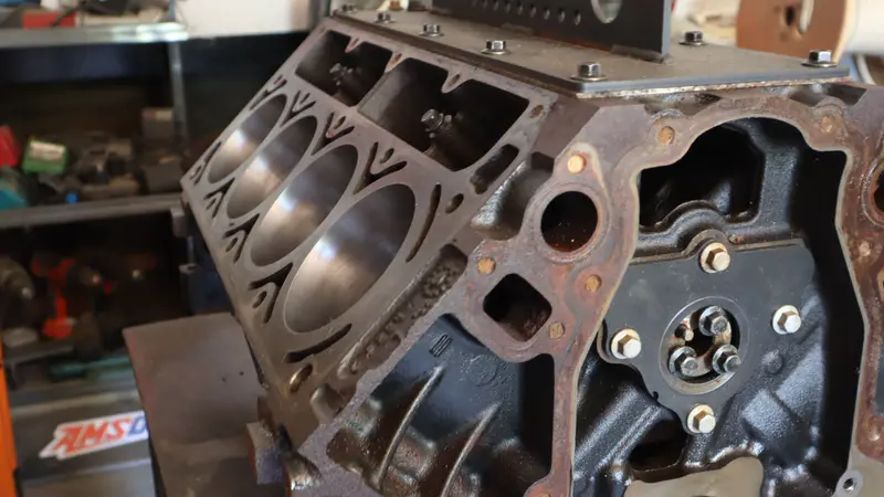 A V8 block on a stand in the machine shop, bores cleaned