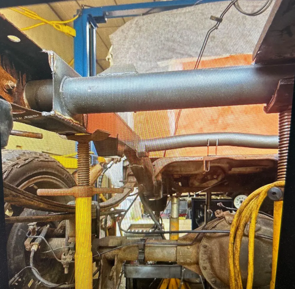 The new crossmember from the other side, screw jacks supporting the frame